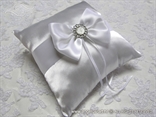 elegant pad for wedding rings with satin bow and brooch