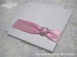 wedding invitation with a heart shaped brooch