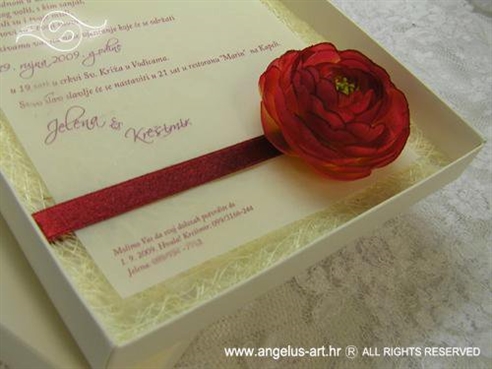 cream and red greeting card in a box