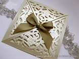 laser cut wedding invitation with golden bow