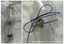 blue invitation for baptism in a bottle with silver heart