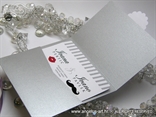 wedding invitation in a silver envelope